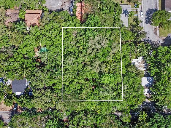 Aerial view of property. Deep lot perfect to build out, big trees on sides of property