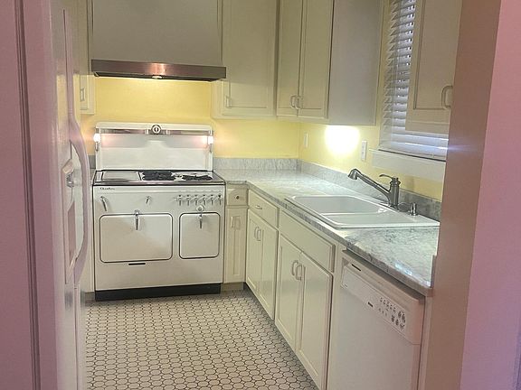 Well appointed kitchen, tile floors, marble counters, side x side fridge with ice/water service in door, Double sink, dishwasher. Lots of storage.