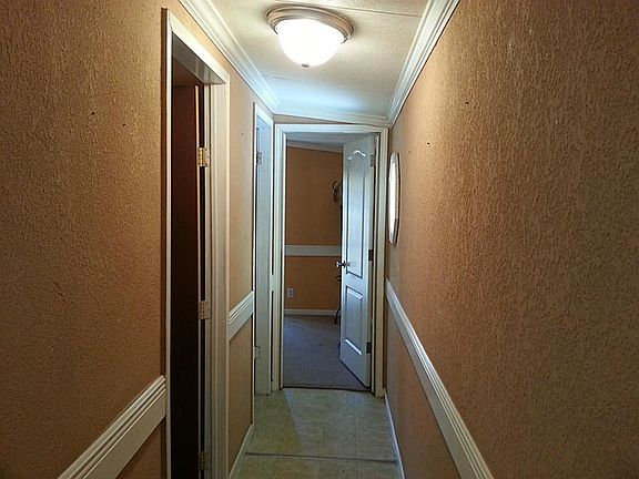 Hallway to secondary bedrooms and bath