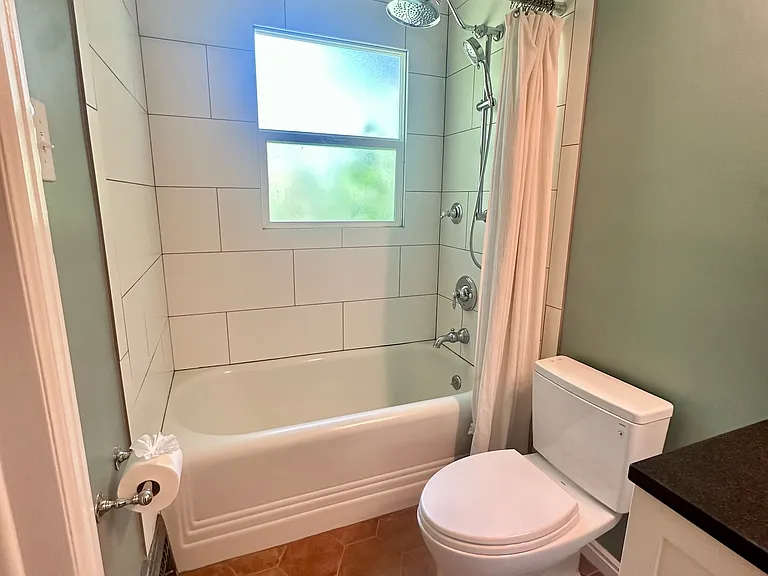 Main floor bathroom with the original deep bathtub