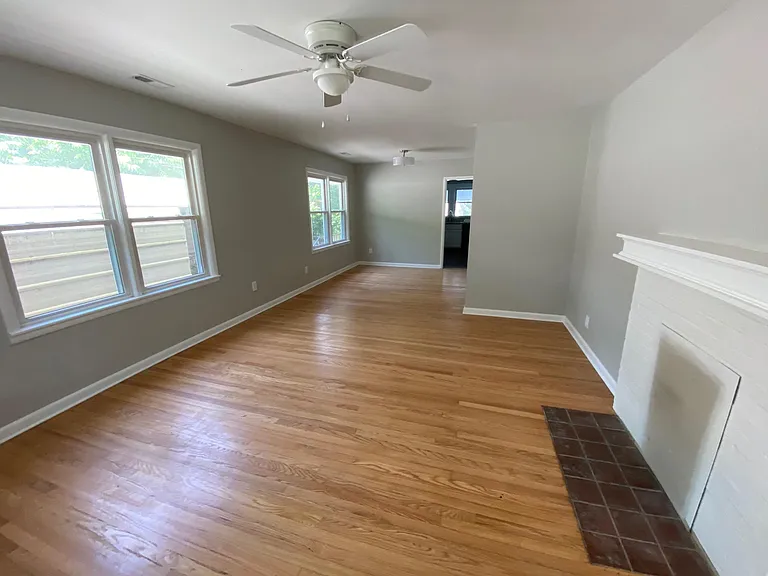 These beautifully restored 1940's wooden floors. Unmistakable craftsmanship. Look brand new! Ceiling fans, lots of windows for airy, spacious feel.