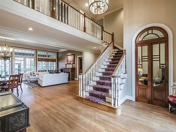 Welcome your guests into the large light and bright two story foyer. The double french doors to the right of the entry lead to the private study.