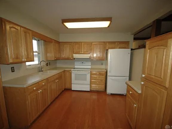 Spacious kitchen with large refrigerator
