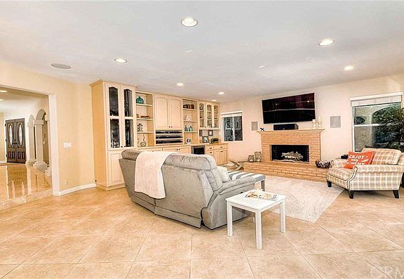 Family room with a fireplace and built-ins