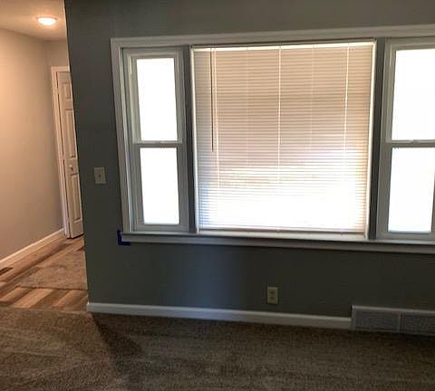 Front window again, looking out onto front porch.