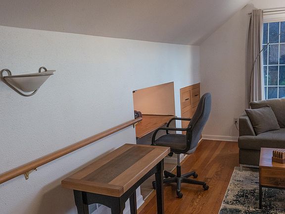 Studio apartment, custom made dining table, desk area.