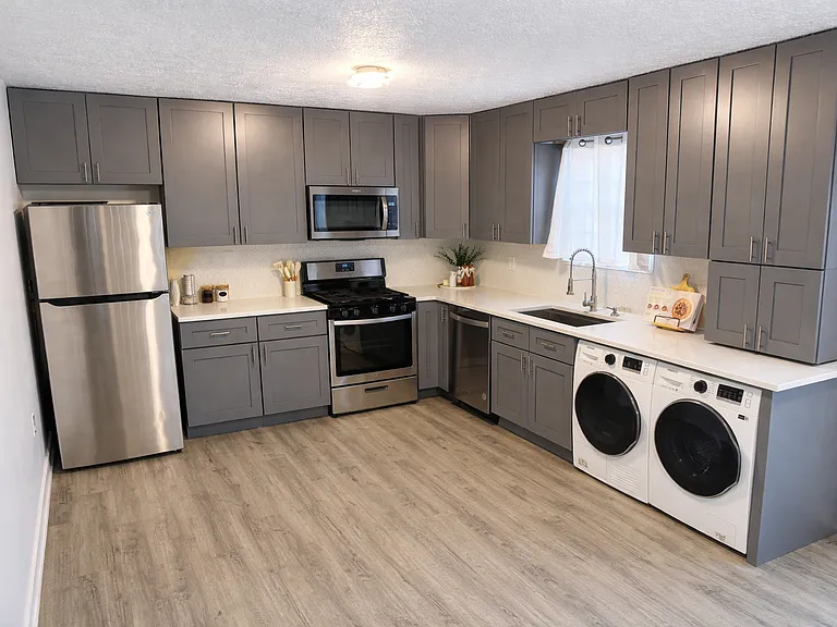 Ground floor - kitchen with new cabinets, appliances and quartz countertop