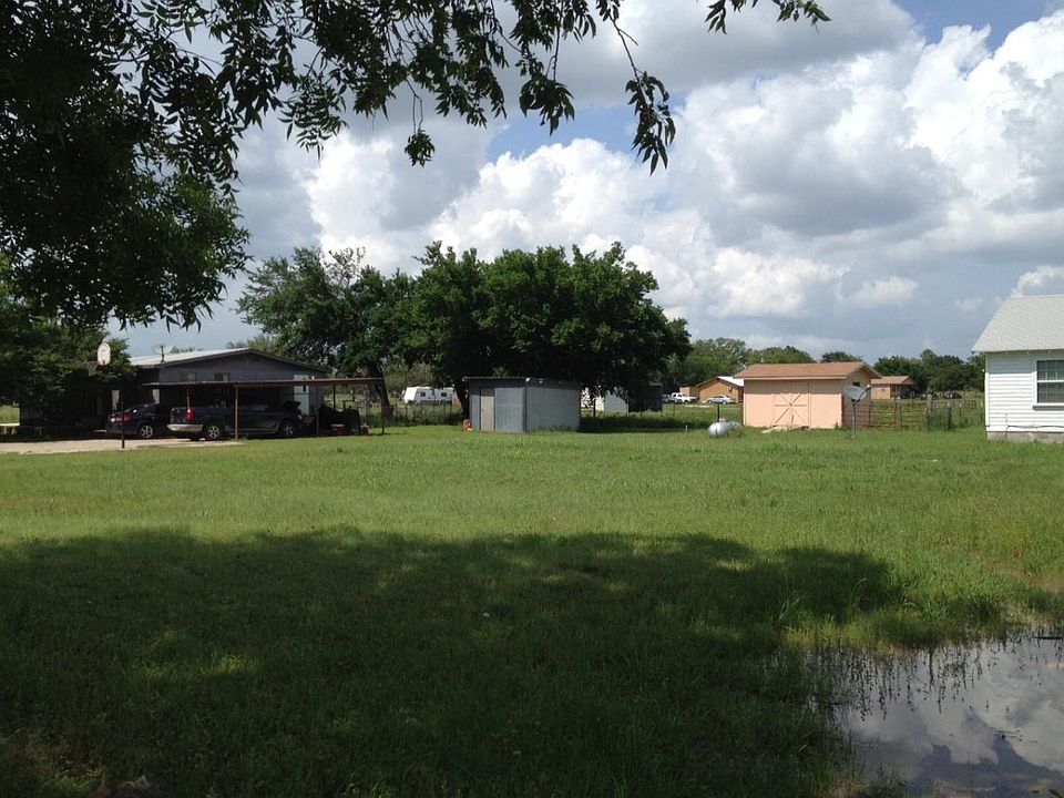 To the left of rental home