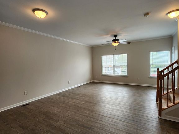 Open floorplan dining and living rooms. Seamless LVP floors