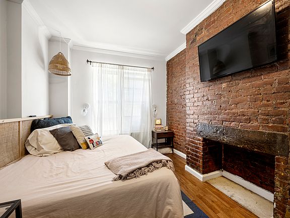 2nd image of 237 E 2nd St APT 2C