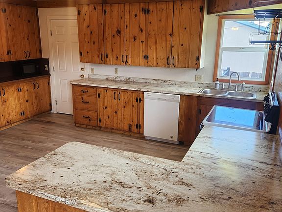 Large kitchen with new flooring and countertops