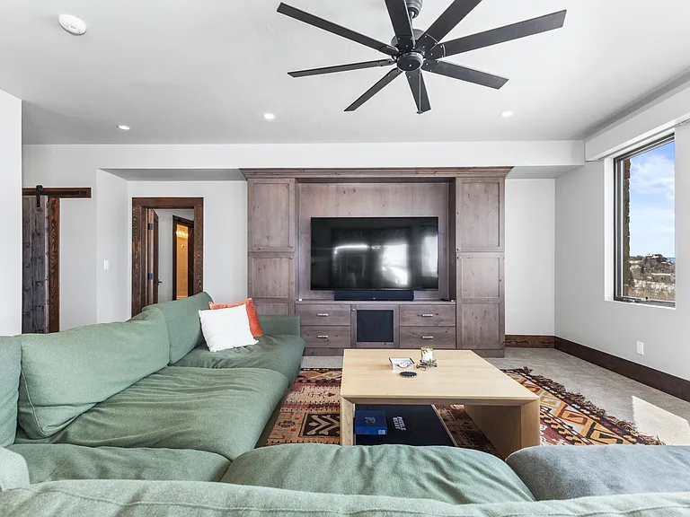 Lower Level Living Room | Ceiling Fan & Smart TV