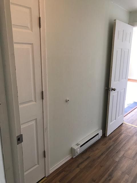 Hallway and closet leading to first floor bedroom