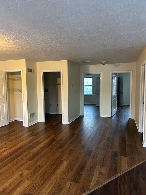 Living Room area looking back into doors for bedrooms