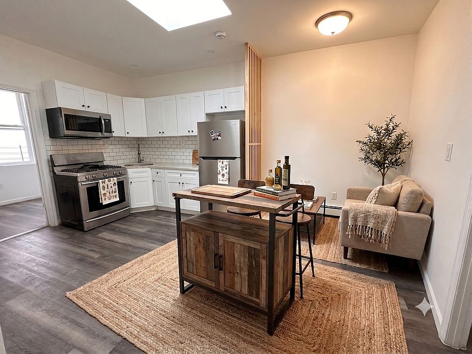 Open Concept Kitchen & Living- This room has been virtually staged using AI to help visualize its layout and design potential.