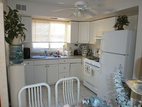 THIS LARGE SOLID BRICK 2 FAMILY SEMI WITH FINISHED BASEMENT LARGE PROPERTY ON 40