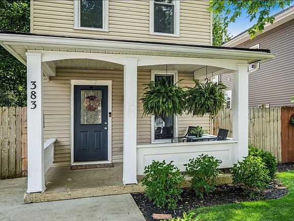 Front Porch Life with Ferns and Seating