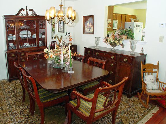 Formal dining room opens with a butler's window to the kitchen for serving ease.