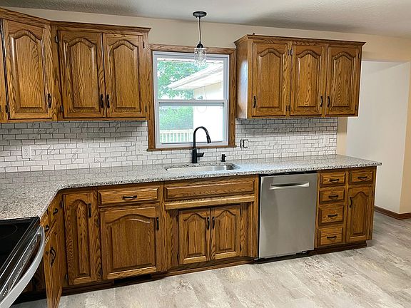 Kitchen with Bosch Dishwasher. Access to Deck at right.