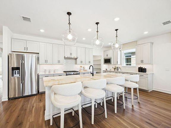 Gorgeous open-concept kitchen with abundant cabinet space
