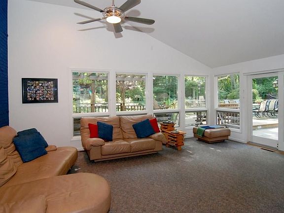 Sunroom with sliding glas doors to multiple decks.