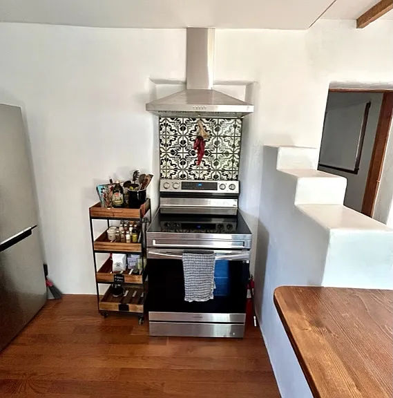 Casita energy efficient stainless steel stove and refrigerator.