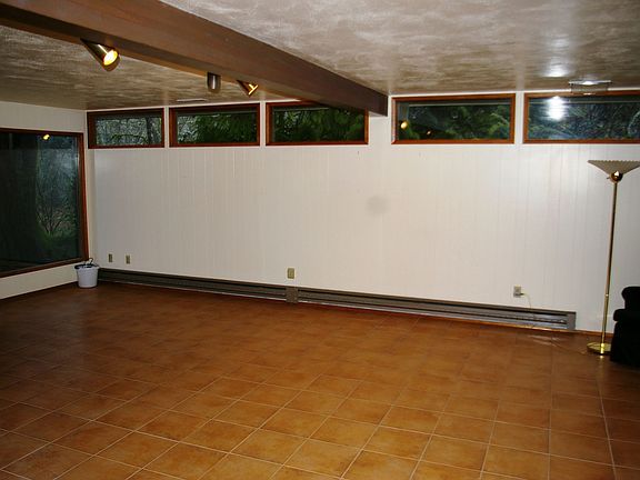 Large great room with tile floors and fireplace