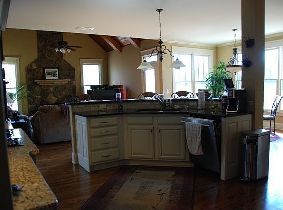 Kitchen looking into Den and Breakfast Area