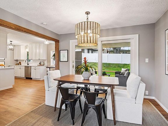 Dining area with sliding doors to deck and backyard