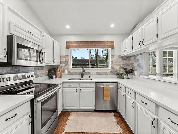 Updated kitchen with stainless appliances and quartz countertops