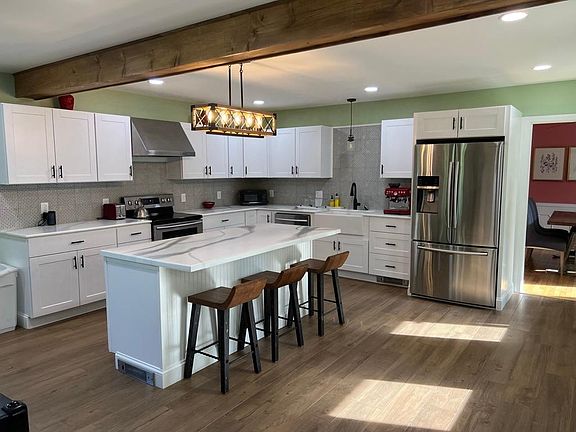 New kitchen with island seating for three
