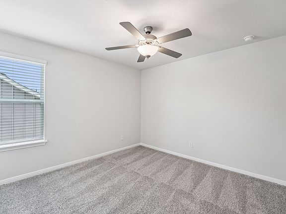Secondary Bedroom in Riverbend at Double Eagle at Meritage Homes in Austin, TX.