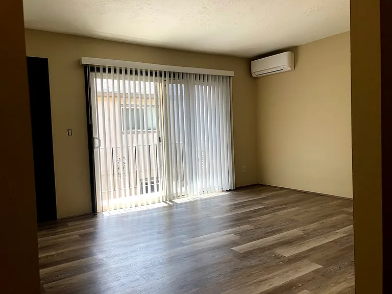 Light, bright living area with balcony space and efficient mini-split heater/AC unit