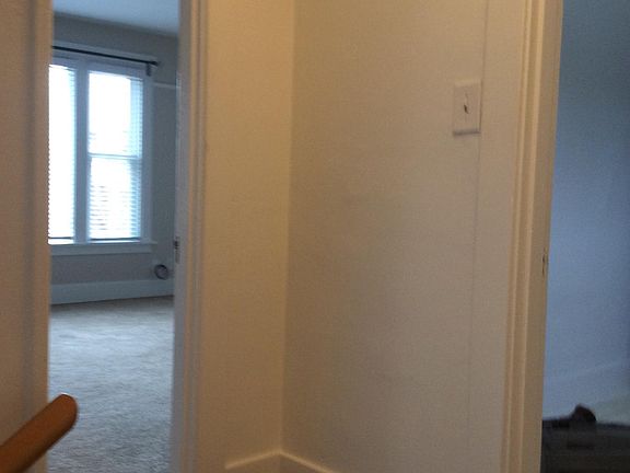 Top of stairs entry hall. Dour to living room and door to laundry room