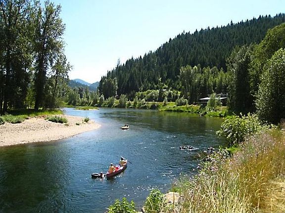 Canoeing Pass-by Waterfront from up the ST Joe River  