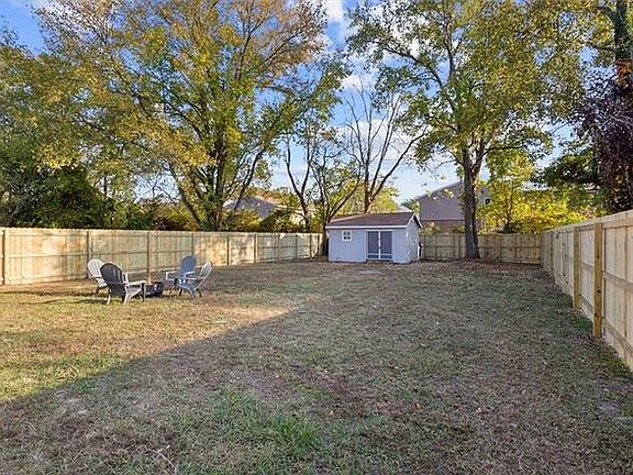 Welcoming backyard to relax around a cozy firepit