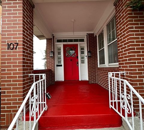 Front exterior of house; brand new paint on porch & front door.