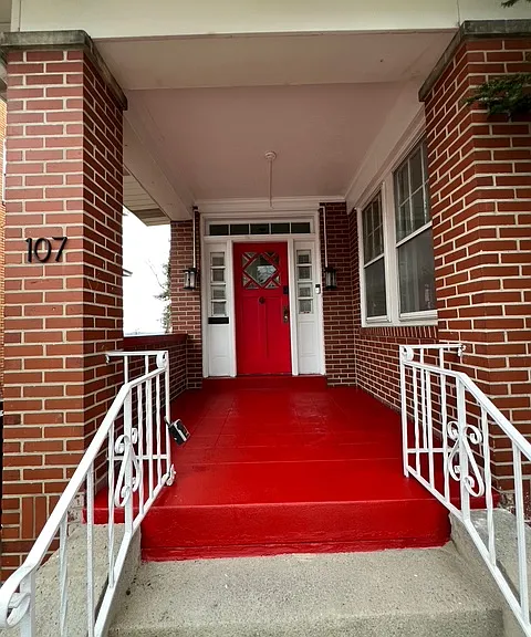 Front exterior of house; brand new paint on porch & front door.