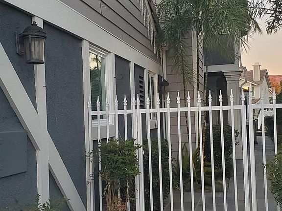 Side gate, entry to backyard and front door.