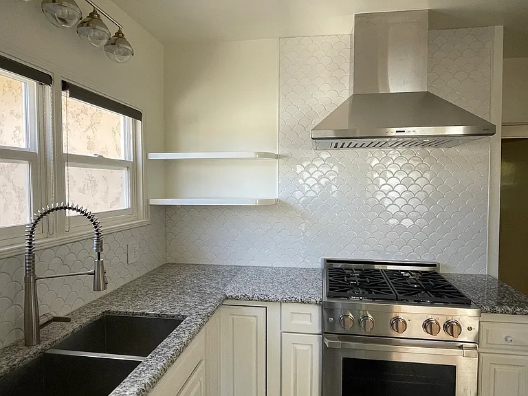Kitchen - new professional gas range and range hood