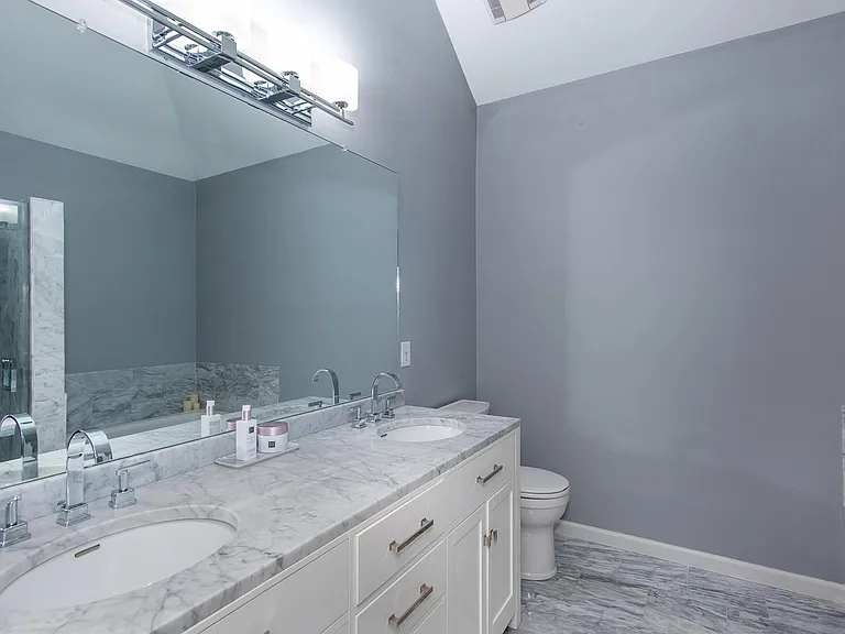 Primary ensuite with double vanities