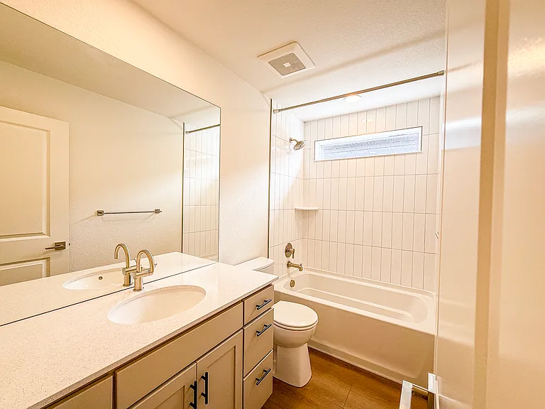 Upstairs Bathroom - Three full bathrooms with modern fixtures and clean, contemporary finishes.