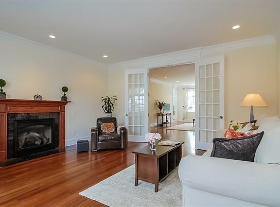 Living room with fireplace and French doors