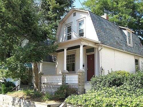 The outside of the home has a covered porch