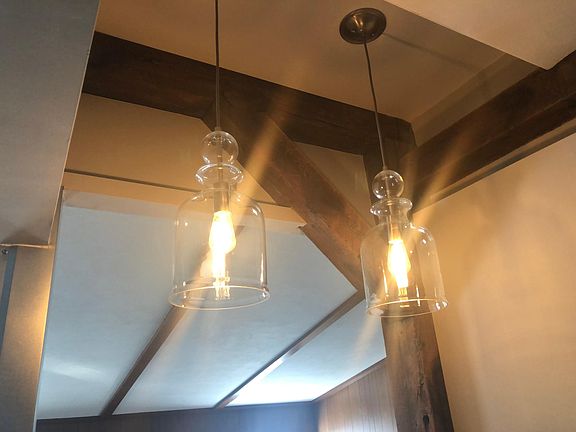 Pendant lighting over bar top table.