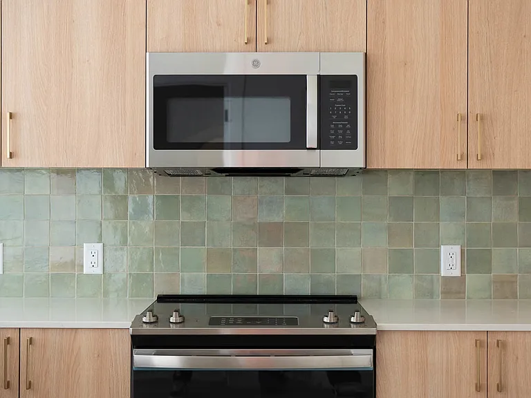 Close up of glazed zellige look tile backsplash.