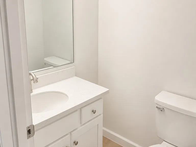 Downstairs Half Bath - NEW flooring, paint, lighting and more!