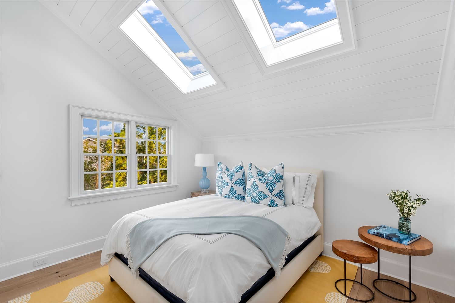 Ensuite guest bedroom with skylights
