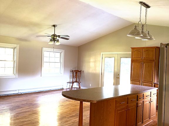 A view from the kitchen. The previous tenants used that room as the dining room. Great lighting in here and back deck access.