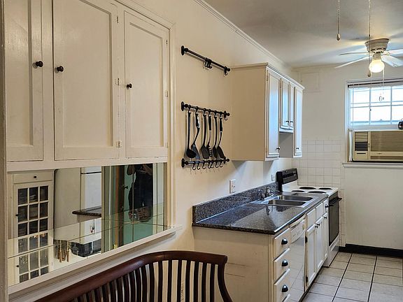 A kitchen with a back exit.